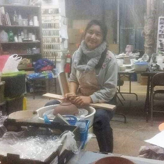 Eunice making pottery.